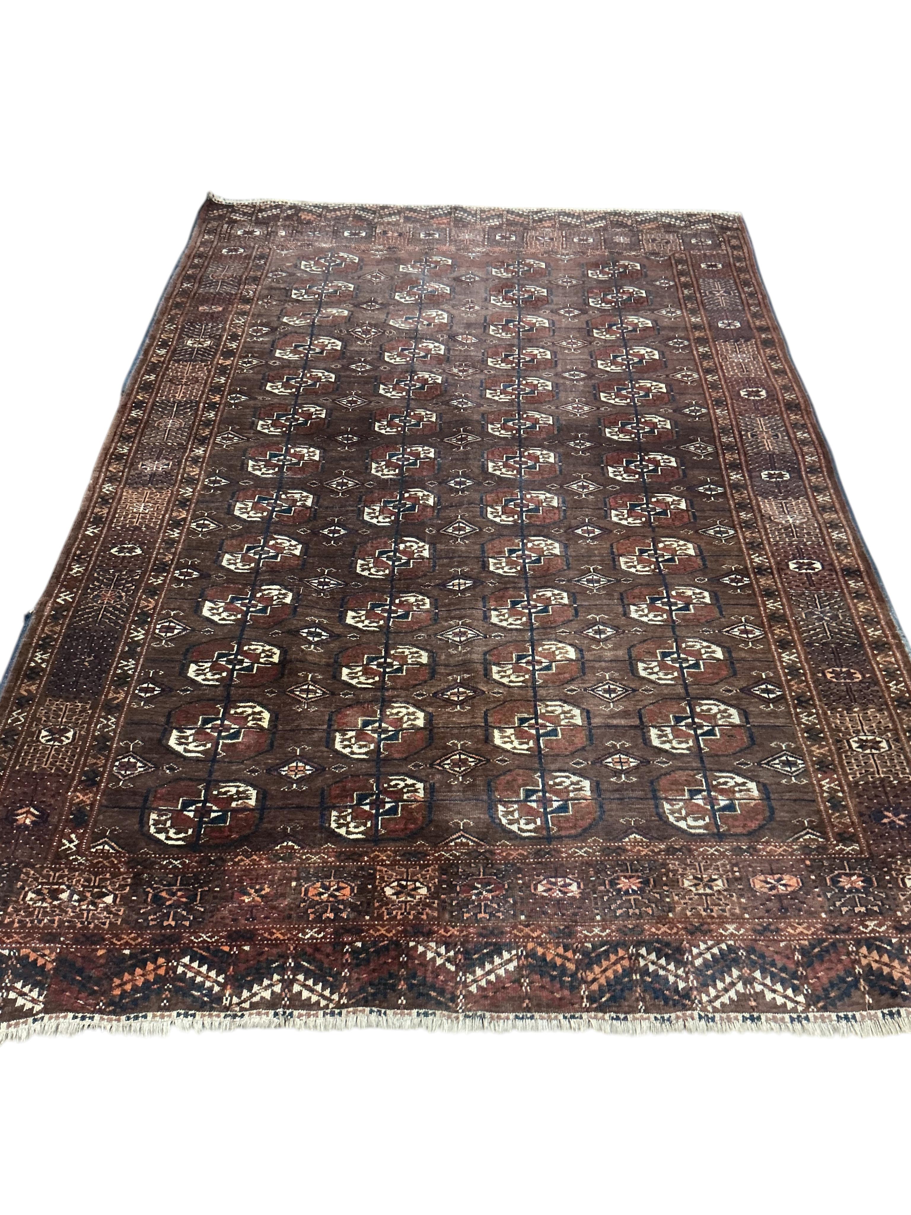 A Tekke Turkoman burgundy ground rug, 260 x 166cm